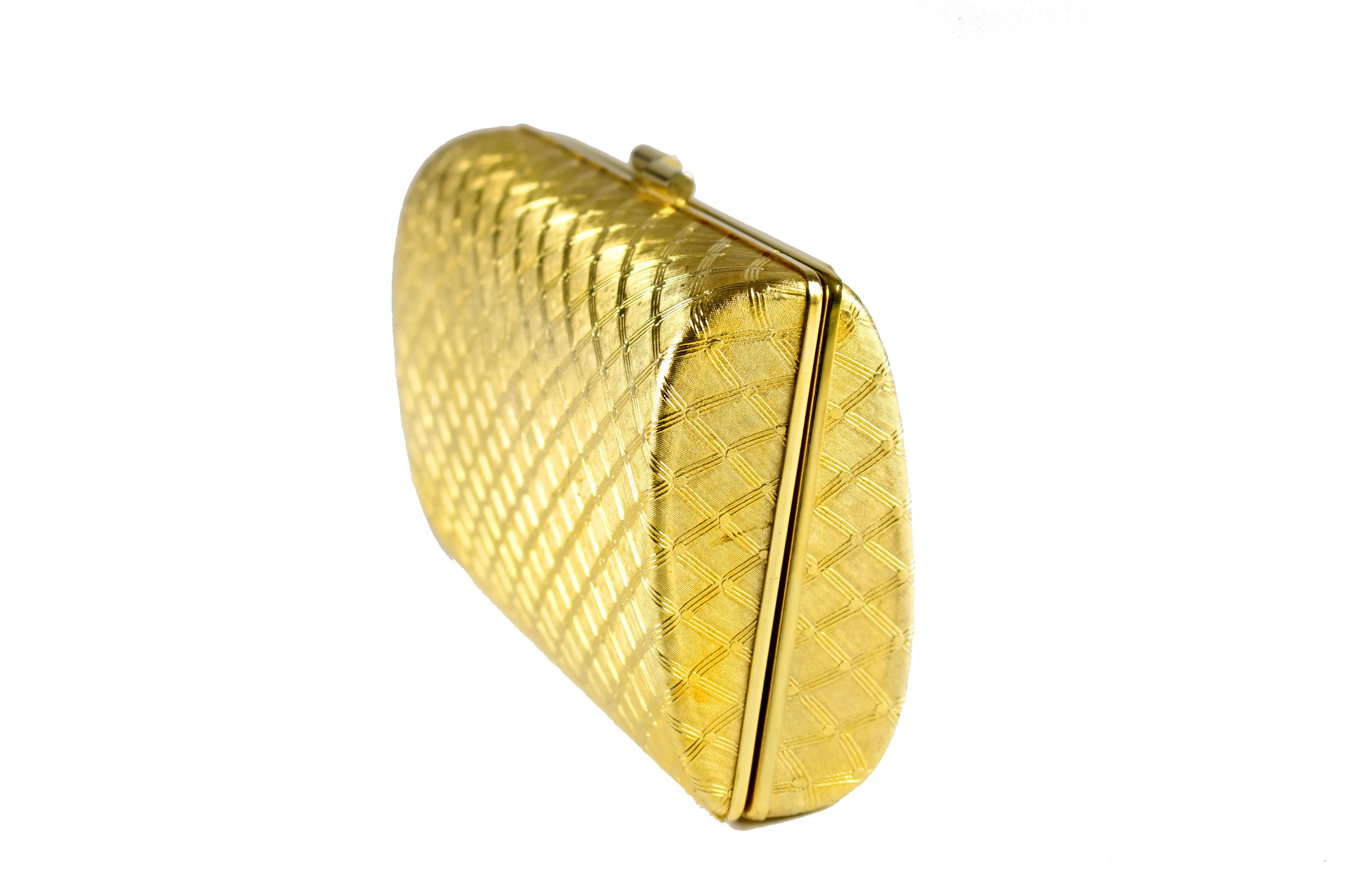 Gold metal clutch with diamond shaped engraving