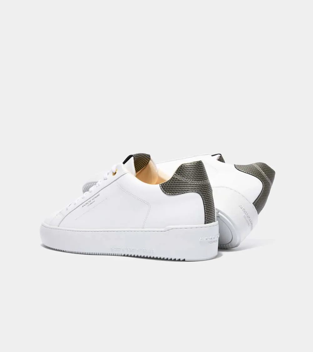 Sure! Here’s an optimized title for your e-commerce product:

Zuma Luxury White Leather Sneakers with Gold Carbon Fiber Detail - Model AHP211-38

This title adds descriptive modifiers that highlight the luxury aspect, the style (sneakers), and the materials involved.