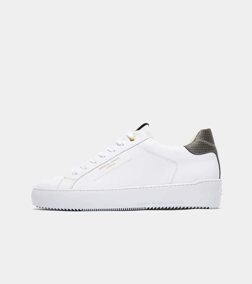 Sure! Here’s an optimized title for your e-commerce product:

Zuma Luxury White Leather Sneakers with Gold Carbon Fiber Detail - Model AHP211-38

This title adds descriptive modifiers that highlight the luxury aspect, the style (sneakers), and the materials involved.